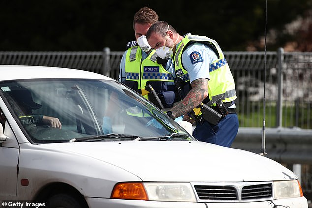 Judge Noel Cocurullo told the 37-year-old mother he had sympathy for their loss but slammed her for putting lives at risk (pictured, New Zealand police at coronavirus checkpoints)