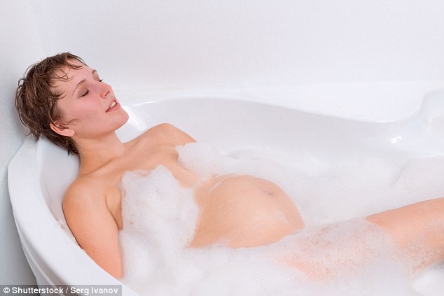 Women can safely take short hot baths or saunas while pregnant without harming their unborn baby, a review has found