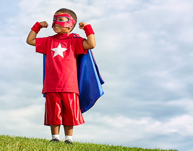 Little boy dressed as a super hero.