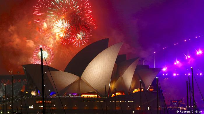 Fireworks explode near the Sydney Opera House as part of new year celebrations on Sydney Harbour, Australia (Reuters/D. Gray)