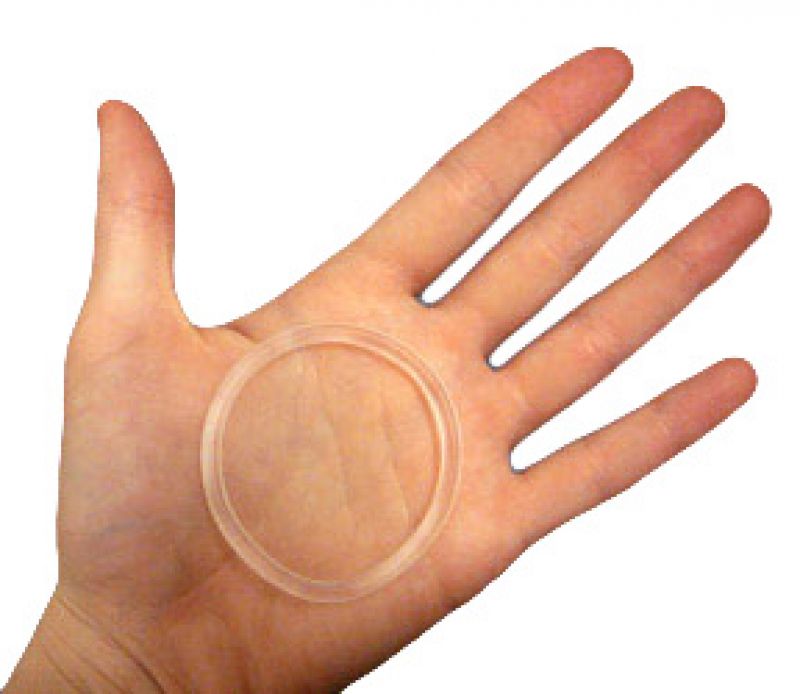 A hand with a contraceptive ring laid flat on it.